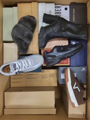 The photo shows a package with footwear in the category AS.