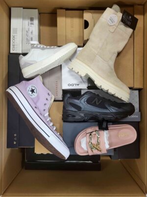 The photo shows a package with footwear in the category AS.