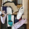 The photo shows a package with footwear in the category AS.