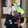 The photo shows a package with footwear in the category AS.