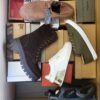The photo shows a package with footwear in the category AS.