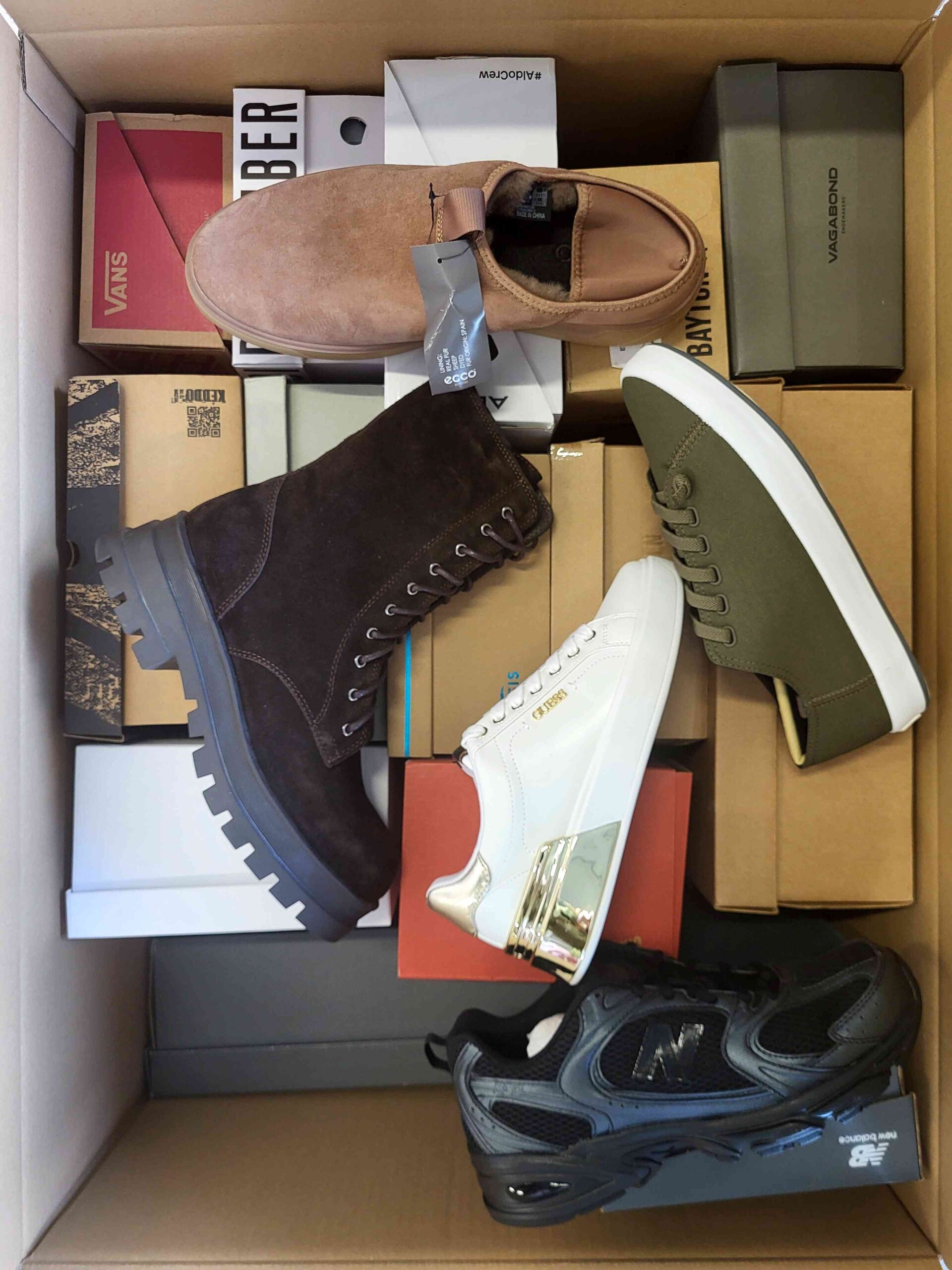 The photo shows a package with footwear in the category AS.