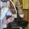 The photo shows a package with footwear in the category AS.