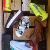 The photo shows a package with footwear in the category AS.