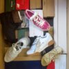 The photo shows a package with footwear in the category AS.