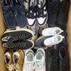 The photo shows a package with footwear in the category SH.
