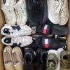The photo shows a package with footwear in the category SH.