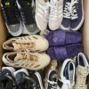 The photo shows a package with footwear in the category SH.