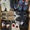 The photo shows a package with footwear in the category SH.