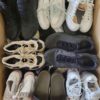 The photo shows a package with footwear in the category SH.