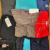 The photo shows a package with clothing in the category U.