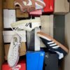 The photo shows a package with footwear in the category BS.