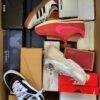 The photo shows a package with footwear in the category BS.