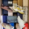 The photo shows a package with footwear in the category BS.