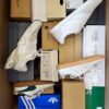 The photo shows a package with footwear in the category BS.