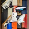 The photo shows a package with footwear in the category BS.