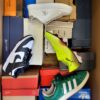 The photo shows a package with footwear in the category BS.