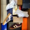 The photo shows a package with footwear in the category BS.