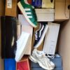 The photo shows a package with footwear in the category BS.