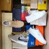 The photo shows a package with footwear in the category BS.