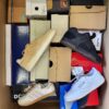 The photo shows a package with footwear in the category BS.