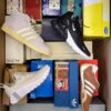 The photo shows a package with footwear in the category BS.
