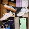 The photo shows a package with footwear in the category BS.