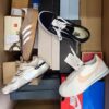 The photo shows a package with footwear in the category BS.