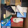 The photo shows a package with footwear in the category BS.