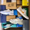 The photo shows a package with footwear in the category BS.