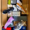 The photo shows a package with footwear in the category BS.