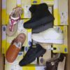 The photo shows a package with footwear in the category SM.