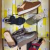 The photo shows a package with footwear in the category SM.