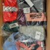 The photo shows a package with clothing in the category AU.
