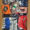 The photo shows a package with clothing in the category AU.