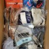 The photo shows a package with clothing in the category AU.