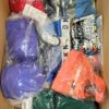 The photo shows a package with clothing in the category AU.