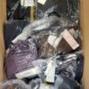 The photo shows a package with clothing in the category AU.