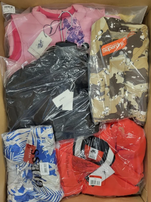 The photo shows a package with clothing in the category AJS.