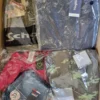 The photo shows a package with clothing in the category AJS.
