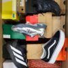 The photo shows a package with footwear in the category CS.