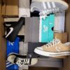 The photo shows a package with footwear in the category CS.
