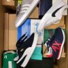 The photo shows a package with footwear in the category CS.