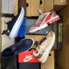 The photo shows a package with footwear in the category CS.