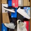 The photo shows a package with footwear in the category CS.