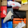 The photo shows a package with footwear in the category CS.