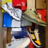 The photo shows a package with footwear in the category CS.