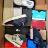 The photo shows a package with footwear in the category CS.