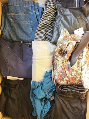 The photo shows a package with clothing in the category TSC.