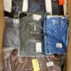 The photo shows a package with clothing in the category AJS.